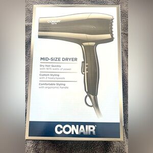 Conair air dryer, black , new , and mid size.new in box never opened